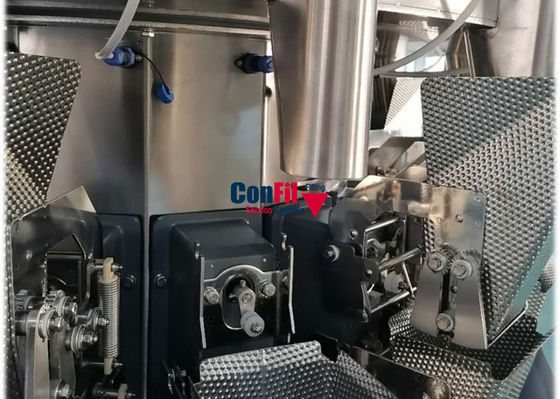 La cabeza 14 conserva en vinagre la balanza de Multihead con el alimentador vertical