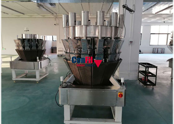 La cabeza 14 conserva en vinagre la balanza de Multihead con el alimentador vertical